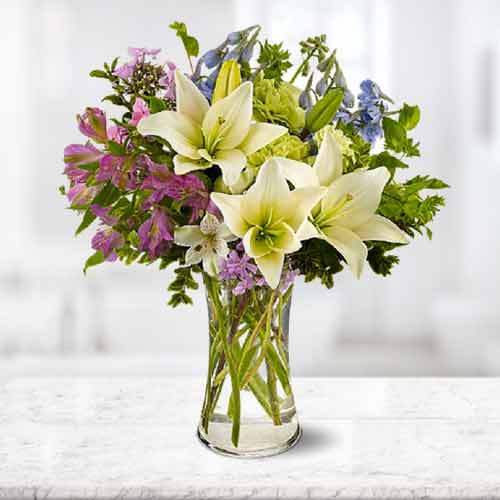 Bouquet of Lilies Delphinium and mixed Blooms